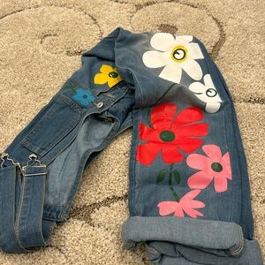 Overalls are back! Super cute, never worn overalls with flowers.